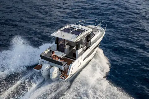Jeanneau NC 895 under way seen from above, showing the aft cockpit and twin outboards