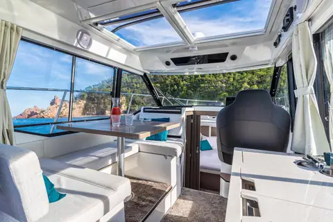 Jeanneau NC 895 wheelhouse saloon with dinette, galley, helm seat and glass roof