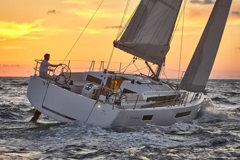 Jeanneau Sun Odyssey 440 cockpit and open transom seen from astern at sunset