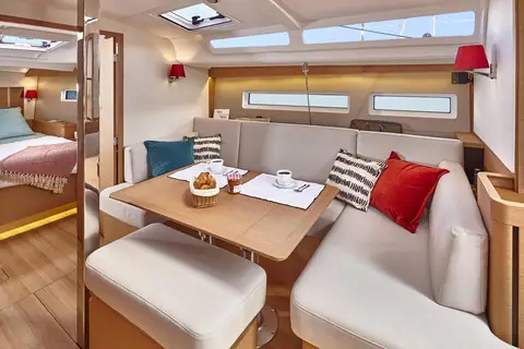 Jeanneau Sun Odyssey 440 saloon with U shaped settee, dinette table and forward cabin