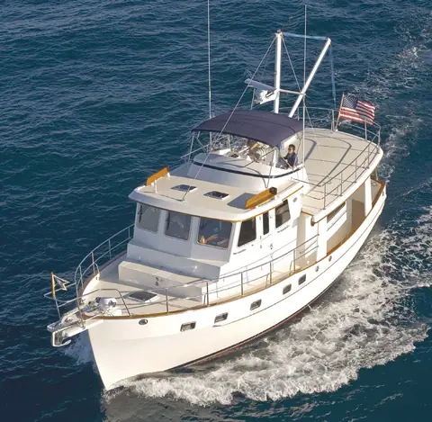 Aerial view of a Kadey Krogen 44 under way with guests on the flybridge