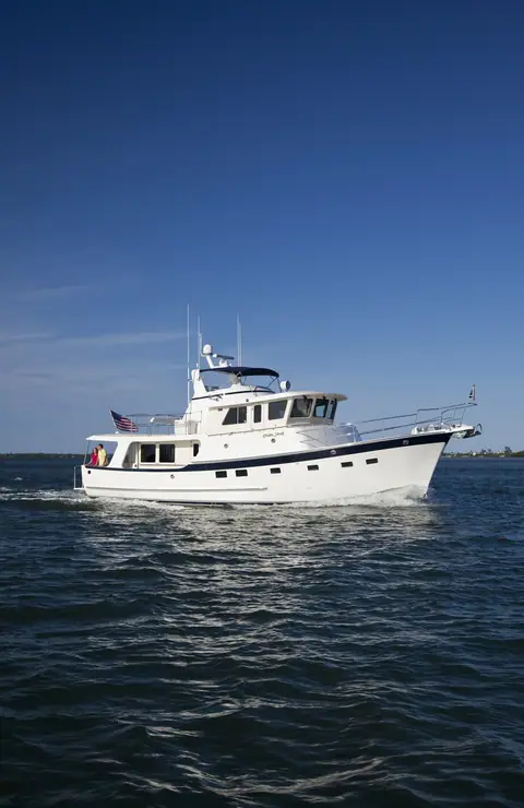 Kadey Krogen 52 running off Stuart, Florida, showing its pilothouse, flybridge and full displacement hull