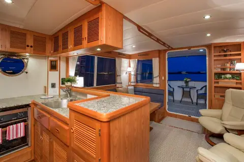 Krogen Express 52 galley with granite counters and an open door to the aft deck