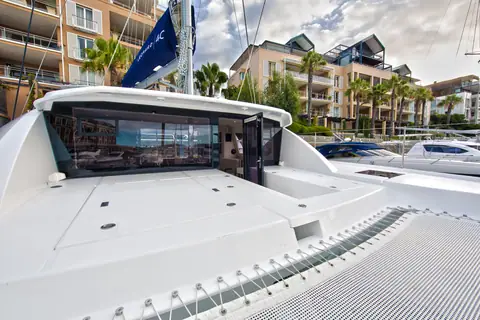 Leopard 40 foredeck and trampoline facing the forward saloon door and windows