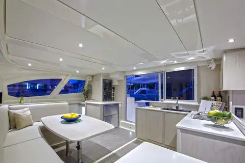 Leopard 44 saloon with a dinette, galley counters and wraparound windows