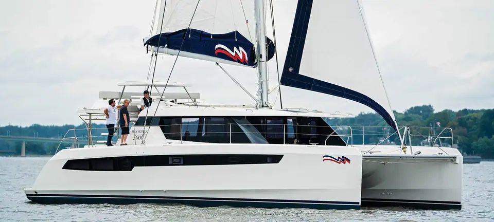 Leopard 50 in Moorings 5000 charter trim sailing in profile with crew on the flybridge