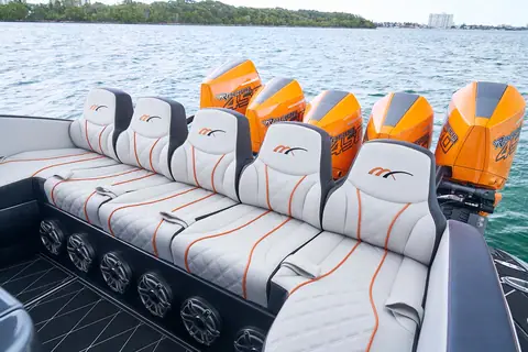 Midnight Express 43 Open helm seating row with orange outboards behind