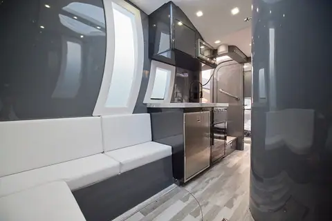 Midnight Express 52 Vitesse cabin with a white settee and galley counter
