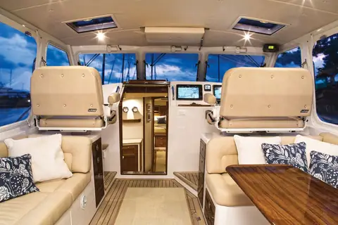 MJM 50z pilothouse with helm seats, settees and the companionway to the cabins