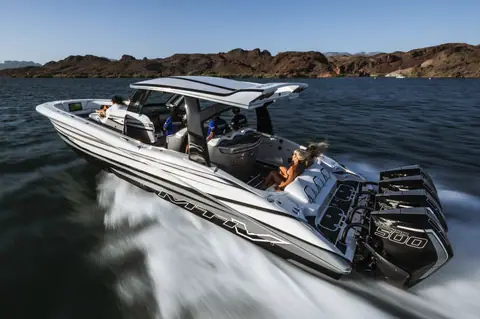 MTI V 42 with black and white graphics carving a turn on a desert lake