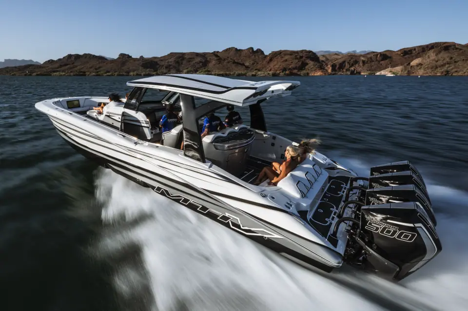 MTI V 42 with black and white graphics carving a turn on a desert lake
