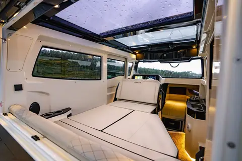 Navan C30 cabin interior with a convertible lounge, glass roof and helm forward