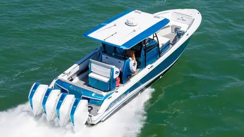 Nor Tech 390 Sport center console with a blue hardtop running on quad outboards
