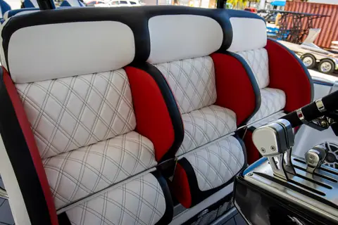Nor Tech 390 Sport helm seats in quilted white and red upholstery