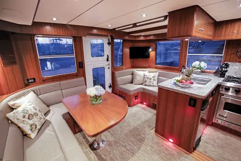 Nordhavn 43 salon settee and dinette with the galley to starboard