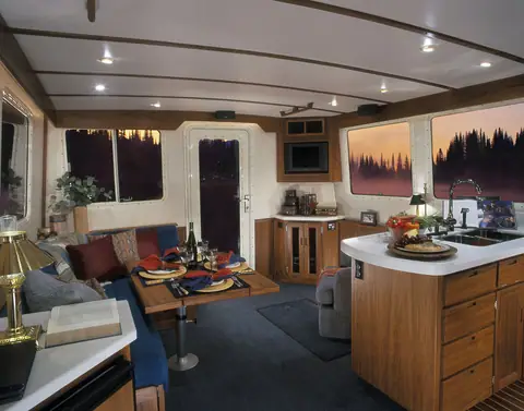 Nordic Tug 42 saloon with dinette, galley island and teak joinery