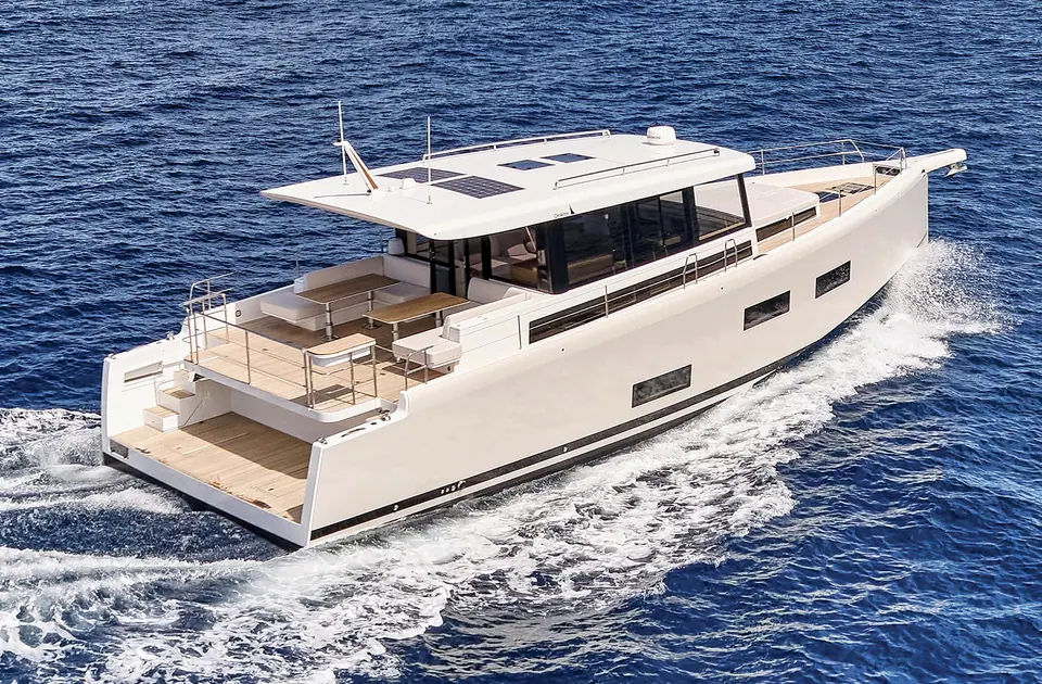 Omikron OT60 running seen from above the stern quarter with its open aft deck