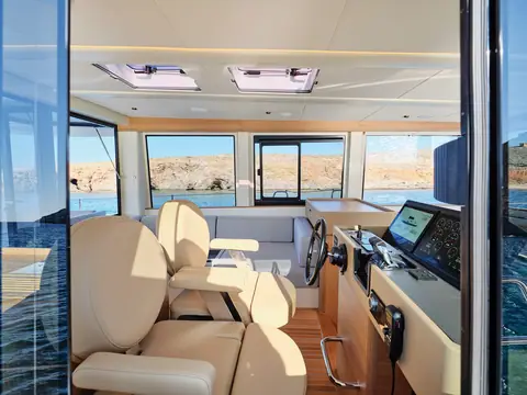 Omikron OT60 main deck helm with twin pilot seats and wide forward windows