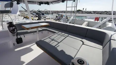 Outremer 51 cockpit with wraparound bench seating and table under the hardtop
