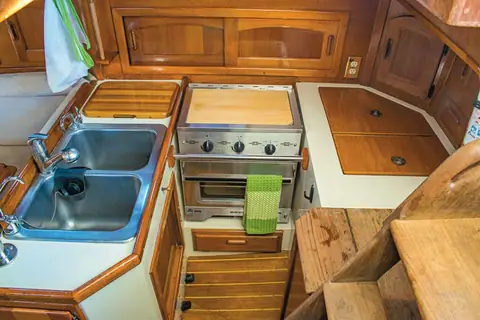 Pacific Seacraft 37 galley with double sink and gimbaled stove on a 1989 boat