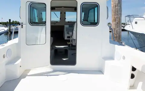 Parker 2320 Sport Cabin cockpit looking forward through the open cabin door