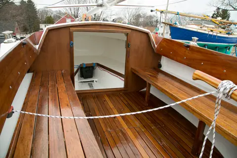Pearson Ensign cockpit with refinished teak seats, sole and cuddy entrance