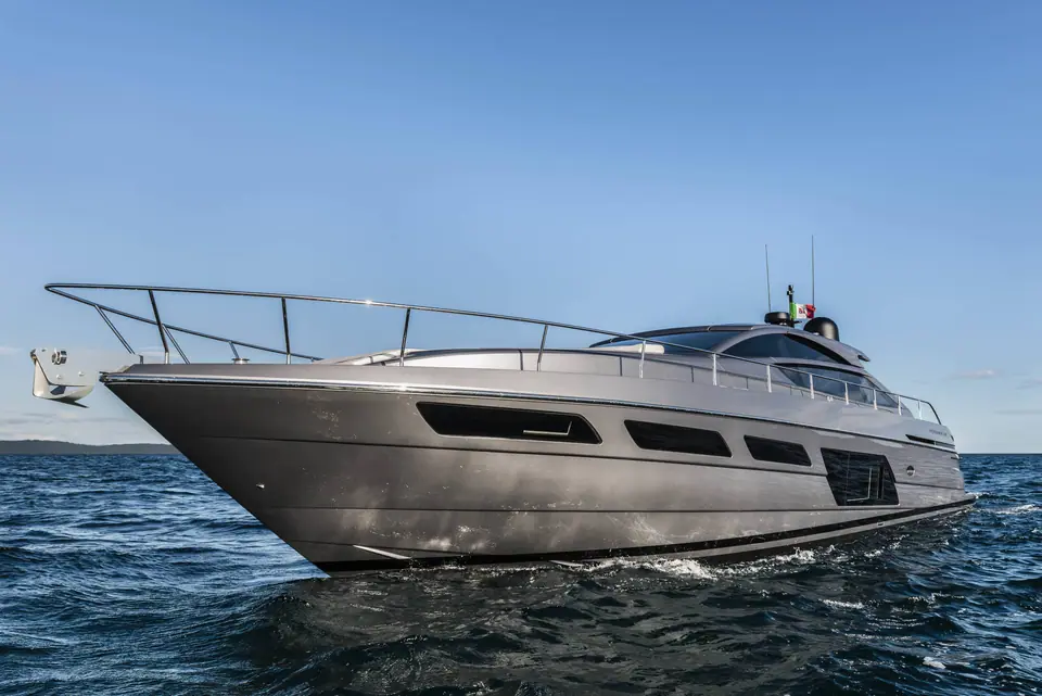 Pershing 6X seen from the bow quarter cruising slowly on calm blue water