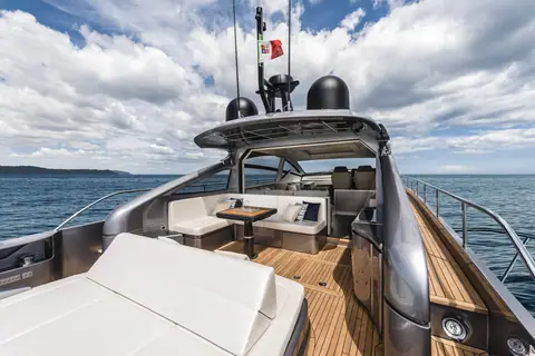 Pershing 6X aft cockpit with dinette and sunpad under the open hardtop