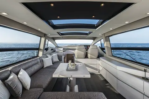 Pershing 7X main deck salon with gray sofas and overhead skylights