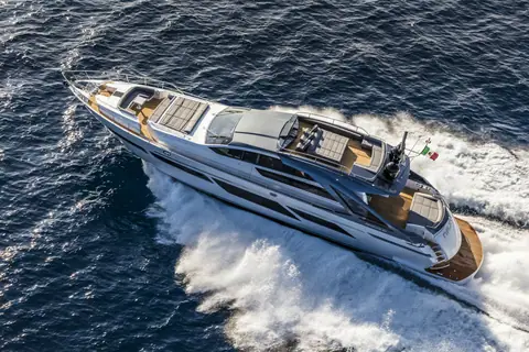 Pershing 9X seen from above at speed showing the foredeck sun pad and flybridge
