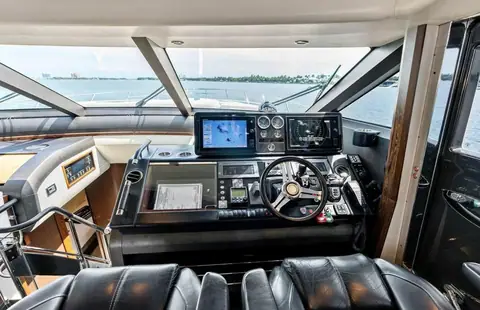 Princess 78 Motor Yacht lower helm with wheel, chart plotters and twin leather helm seats