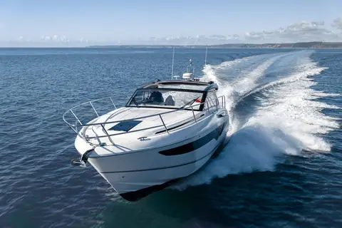 Princess V40 seen from the bow quarter carving a turn at speed