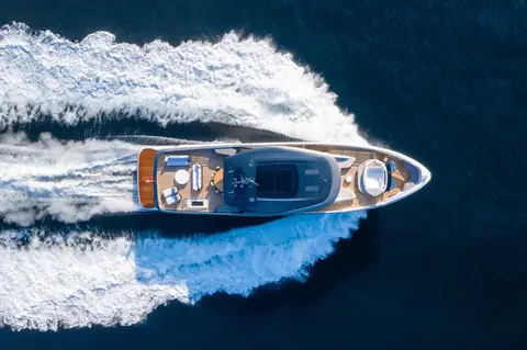 Princess X95 seen from directly above at speed showing the full length foredeck and flybridge