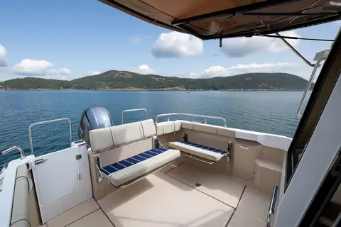 Ranger Tugs R-23 cockpit with transom seating and the outboard bracket astern