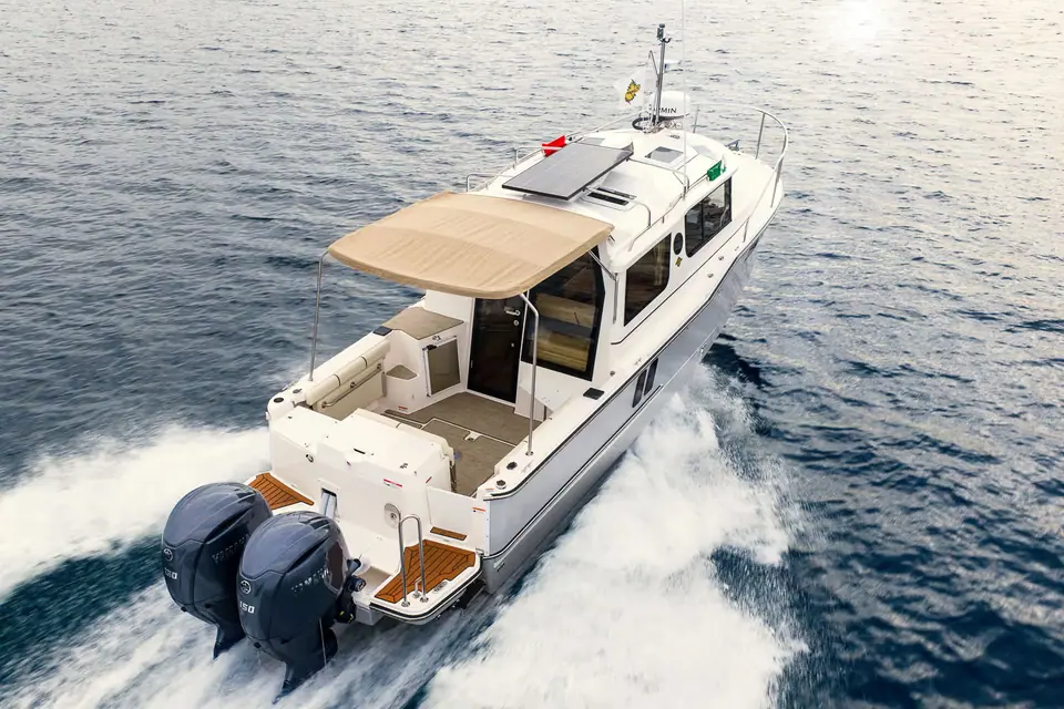 Ranger Tugs R-27 seen from above the stern quarter at speed showing the cockpit and hardtop