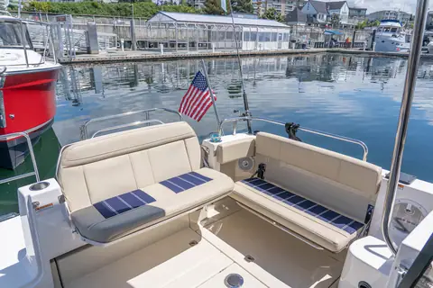 Ranger Tugs R-29 S cockpit with an L shaped settee and transom seat