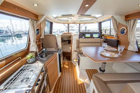 Ranger Tugs R-29 S cabin looking forward past the galley and dinette to the helm