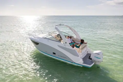 Regal 26 XO at rest in clear shallow water seen from the stern quarter