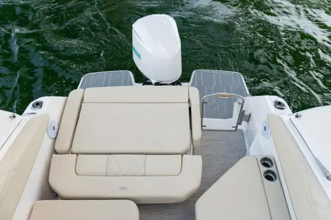 Regal 26 XO aft cockpit with a fold down transom seat and the outboard behind