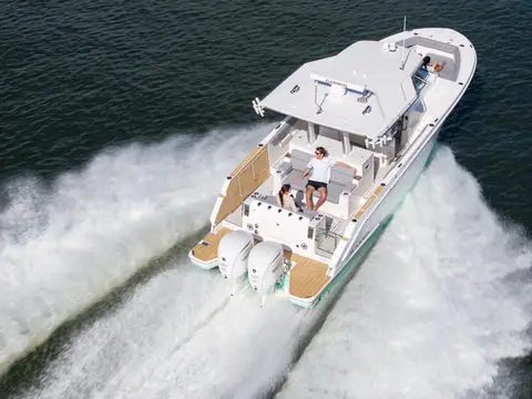 Regal 34 SAV seen from above the stern quarter running fast with a wide white wake
