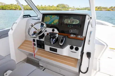 Regal 34 SAV helm with twin displays, wheel and joystick under the hardtop