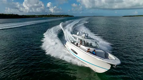 Aerial view of the Regal 43 SAV carving a turn at speed on triple outboards
