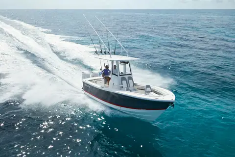 Regulator 23 seen from above running through turquoise water with a full fishing rig