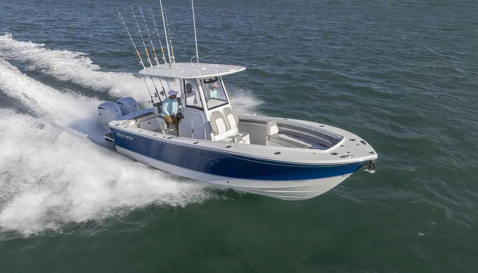 Regulator 25 running at speed with twin outboards and a full rocket launcher of rods