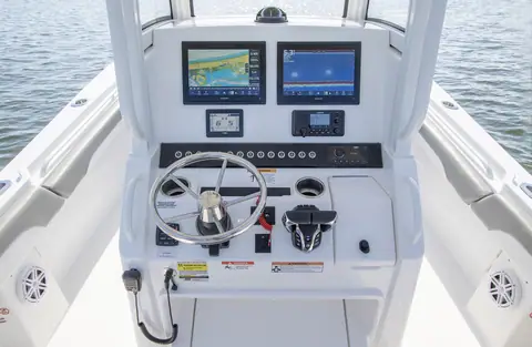 Regulator 25 helm console with twin Garmin displays, stainless wheel and controls