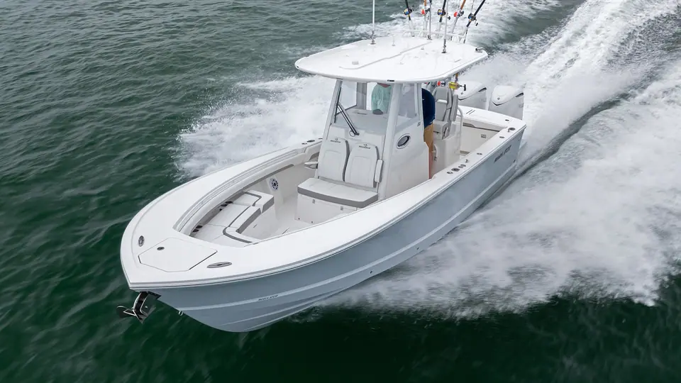 Regulator 28 seen from above running at speed with bow seating and helm visible