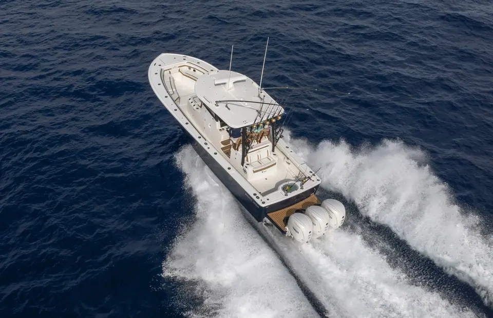 Regulator 35 seen from above running at speed on triple outboards