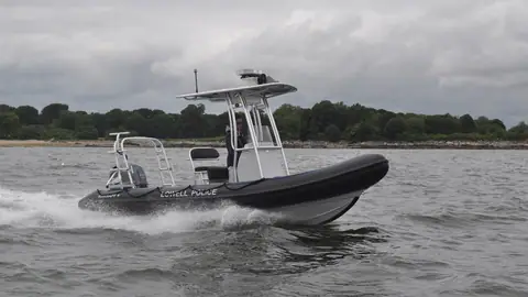 RIBCRAFT 5.85 Professional running with a gray tube, center console and aluminum T top