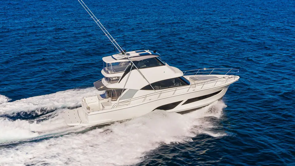 Riviera 50 Sports Motor Yacht running at speed seen from above on deep blue water