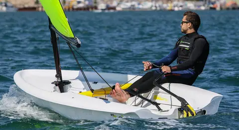 RS Zest cockpit with the helmsman hiking on the side deck and the toe strap visible